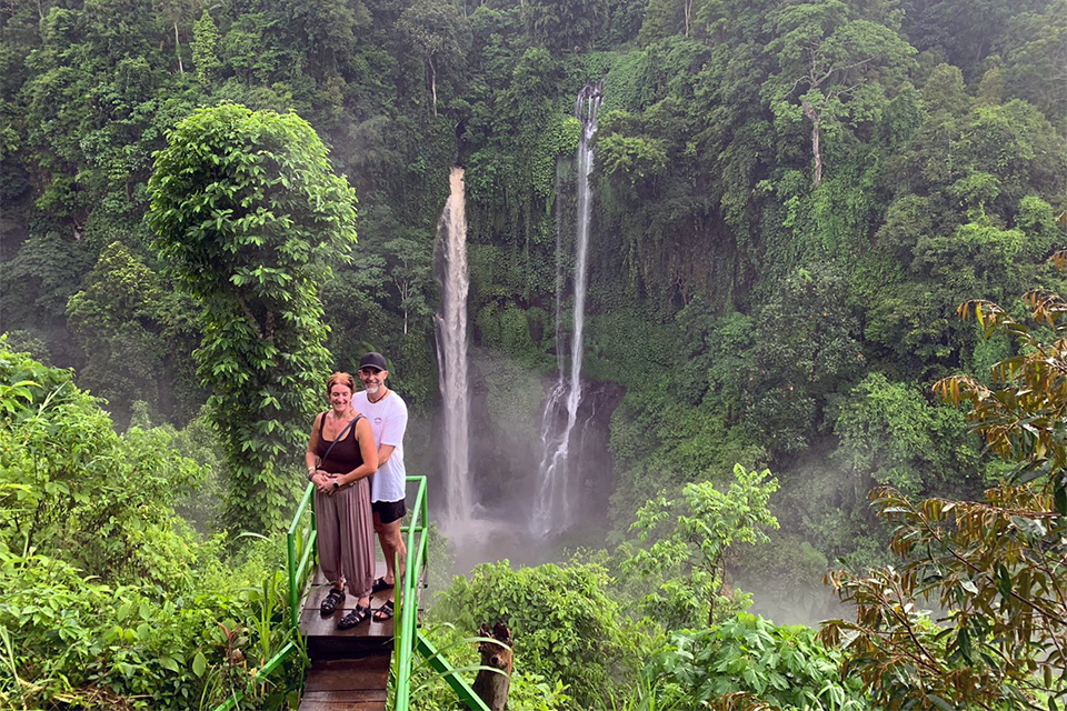 Bali couple holidays exploring waterfalls for Australian travelers.